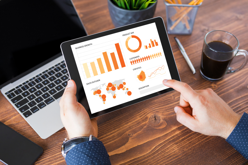 Businessman,Using,Tablet,Computer,At,Work. sap marketing cloud